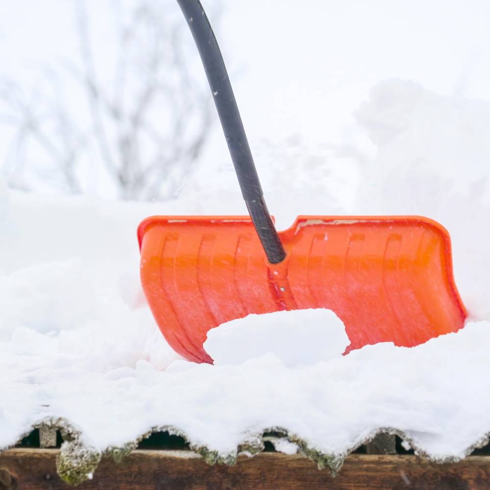 Plastic shovel cleaning snow